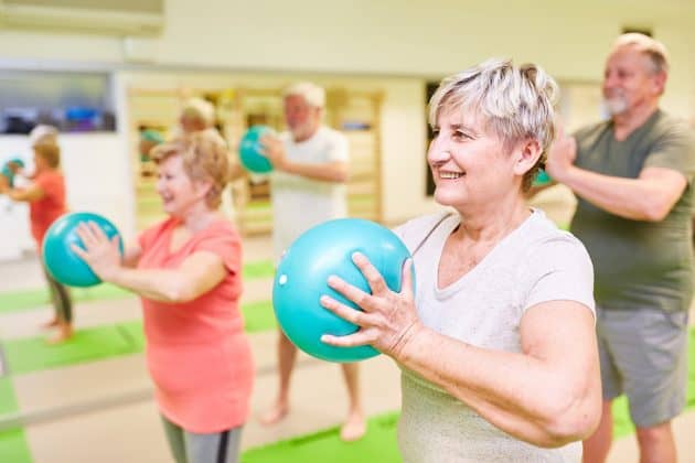 A group of seniors participating in a group exercise class to keep themselves active during the winter months.