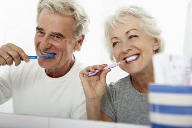 A smiling senior shows off his pearly whites at his son’s wedding