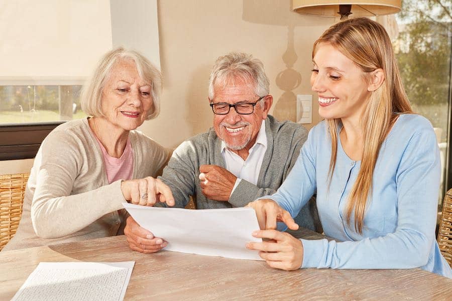 A daughter working with her parents to help them start planning their downsizing transition.