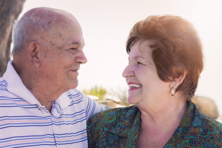 A senior couple enjoys a special moment together.