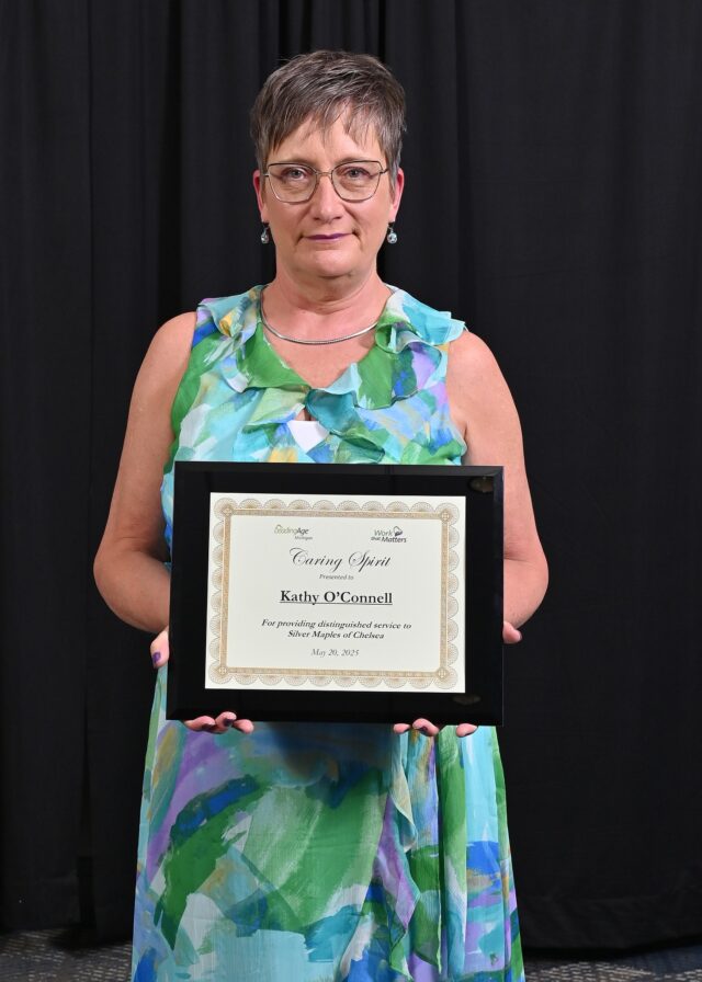 💖 Caring Spirit Spotlight: Kathy O’Connell 💖

Join us in congratulating Kathy O’Connell, Courtyard Café Attendant, who received the 𝗖𝗮𝗿𝗶𝗻𝗴 𝗦𝗽𝗶𝗿𝗶𝘁 𝗔𝘄𝗮𝗿𝗱 at the 2025 LeadingAge Michigan Member Awards Gala! 🌟

Kathy brought over 35 years of experience in the restaurant and hospitality industry to Silver Maples when she joined our team in 2019. Since then, she has become the heart and soul of the Courtyard Café—nourishing residents, staff, and guests while creating a warm, welcoming space where everyone feels seen and valued.

She’s known for her joyful energy, snapping fingers and dancing to the oldies, and for crafting creative menu options that accommodate special diets like vegan, gluten-free, sugar-free, and low sodium—ensuring all residents, staff and guests enjoy delicious meals.

Kathy’s energy is contagious, her care is genuine, and her presence makes Silver Maples feel like home. 

🎥 Watch Kathy’s tribute video:
👉 https://youtu.be/-muYPrX8fsc?si=RpwAnN7-X7PoB_MH

Congratulations, Kathy! Thank you for all the ways you serve with heart.
#CaringSpirit #LeadingAgeMI #SilverMaplesProud #SeniorLivingWithHeart #MissionDrivenCare